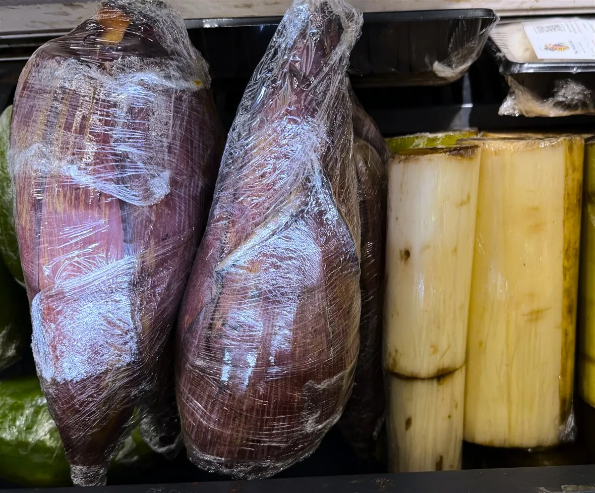Wrapped banana blossoms and cut banana stems on display